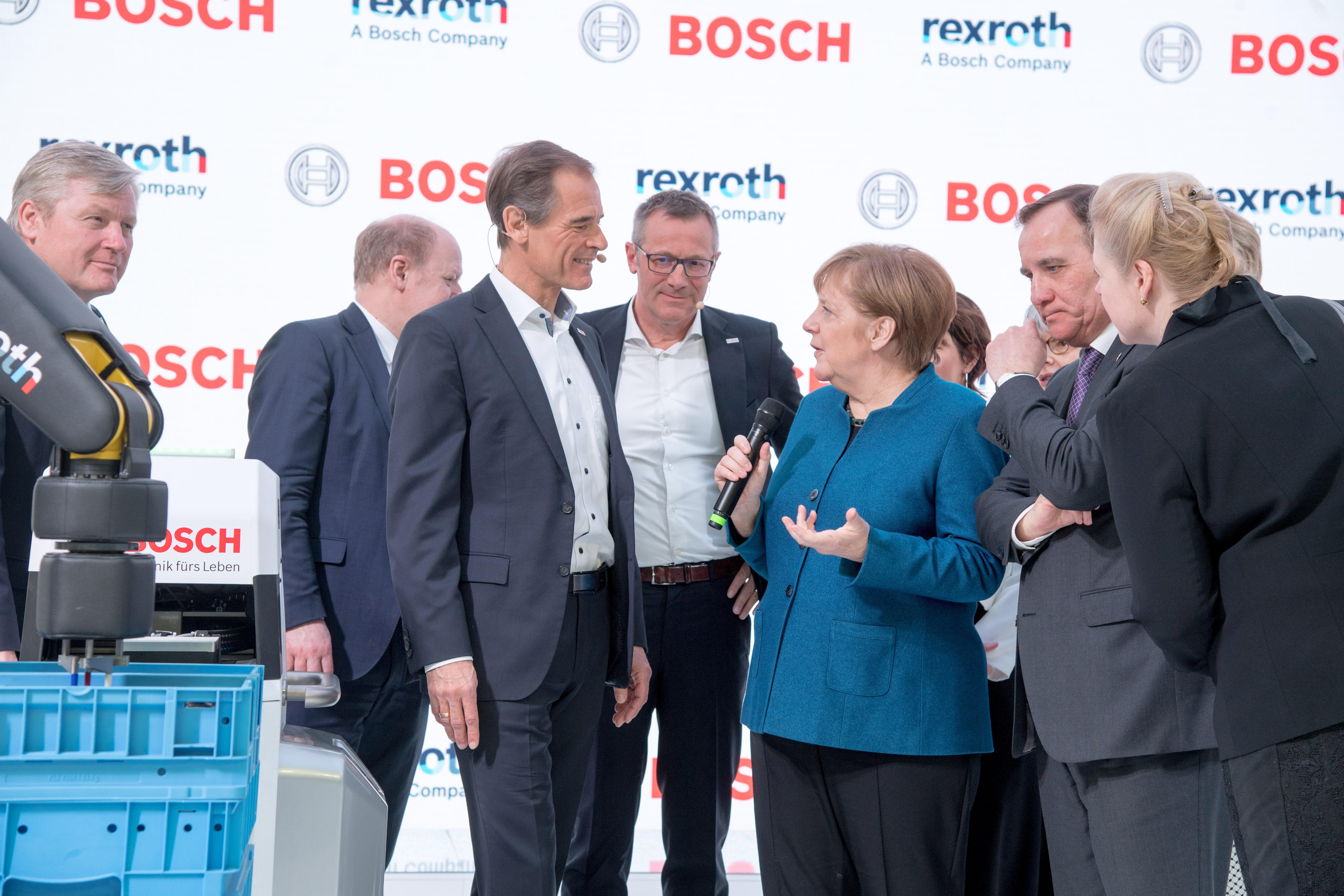 Angela Merkel visits the Bosch booth at the Hannover Messe. Volkmar Denner, chairman of the board of management of Robert Bosch GmbH, explains the factory of the future