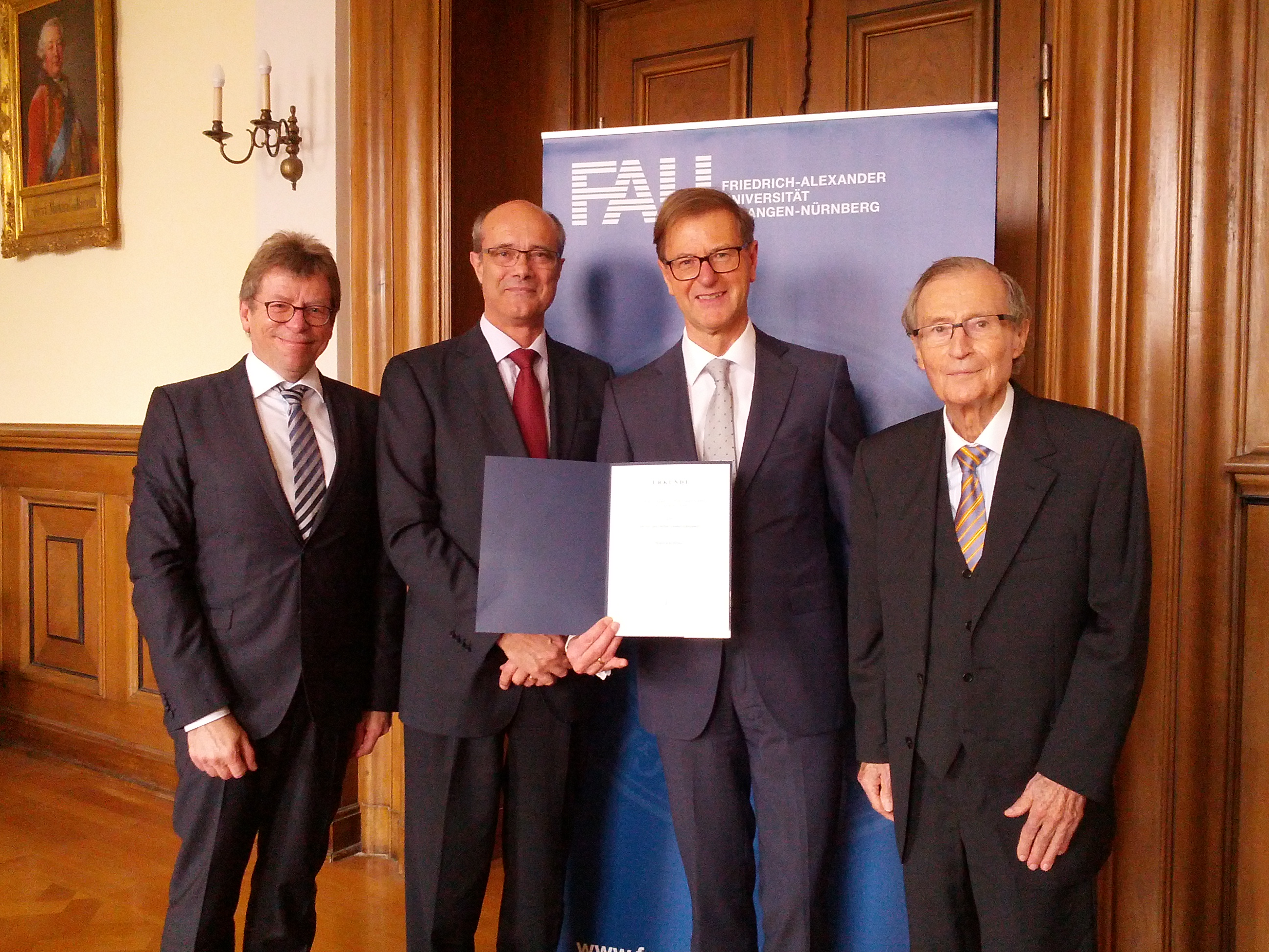 Dr. Stefan Asenkerschbaumer receives the deed  conferring the title of honorary professor.