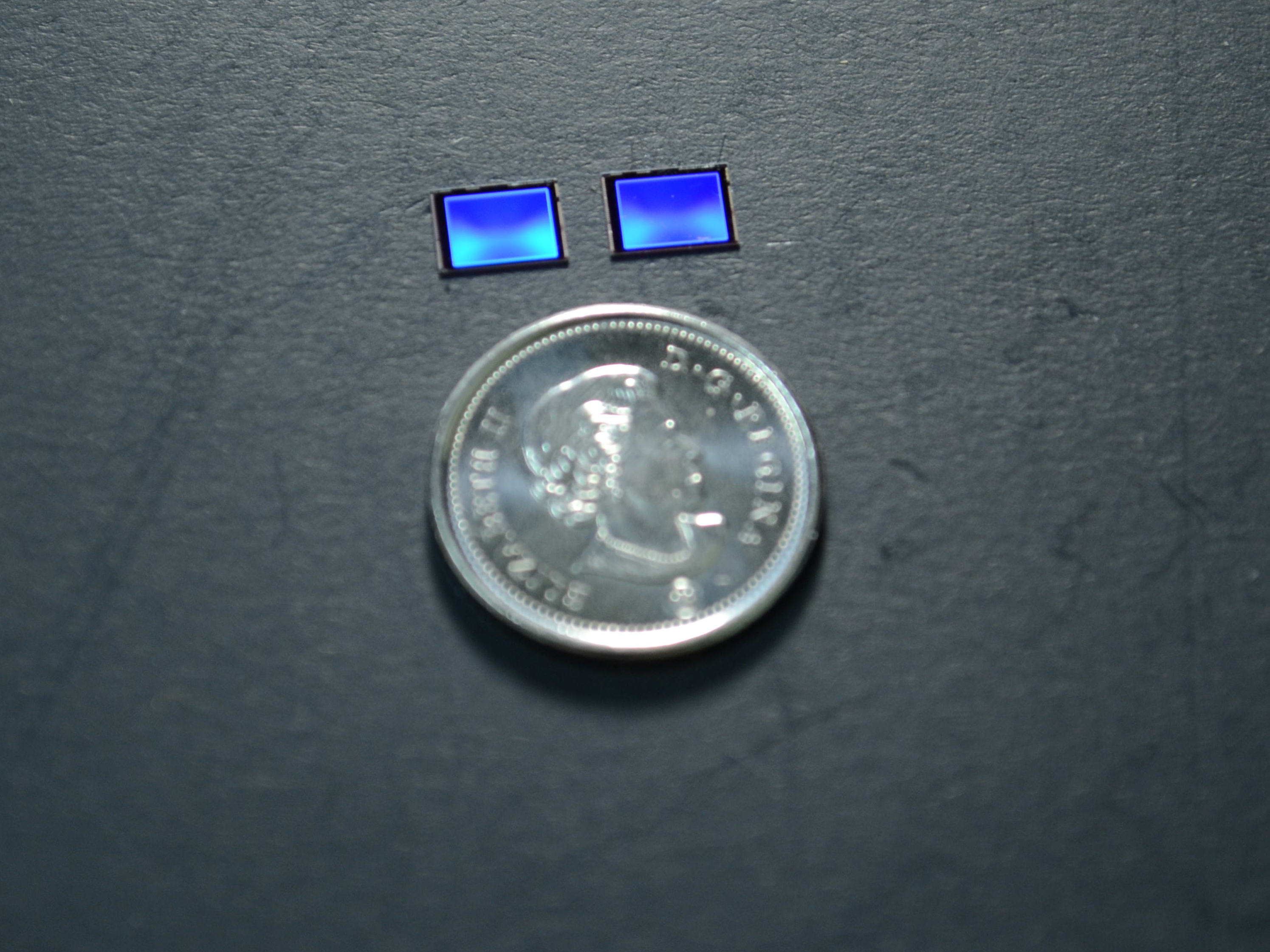 Two 5x7 mm imager chips - a bare one that is 2D and another with AIRY3D's patented TDM that is 3D